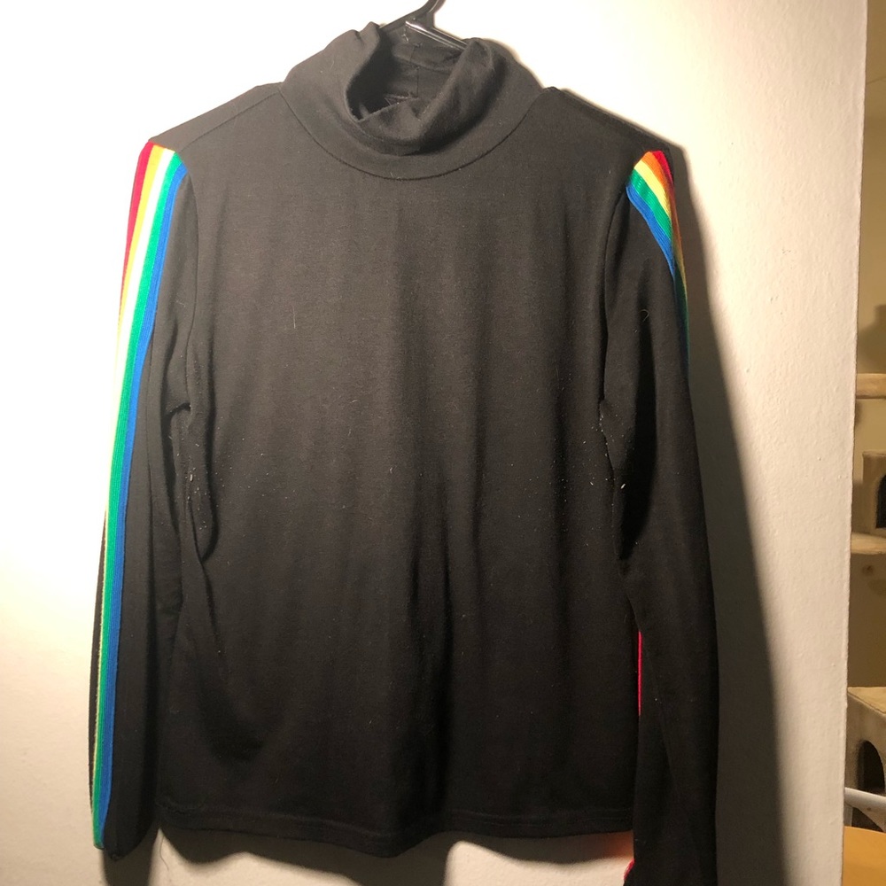 Black turtleneck with rainbow stripe arms